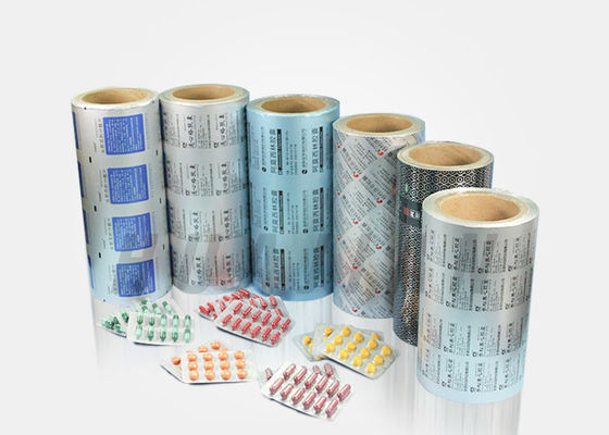 Le pillole farmaceutiche delle compresse della capsula che imballano l'oro di stampa colorato hanno ricoperto la stagnola di alluminio della bolla